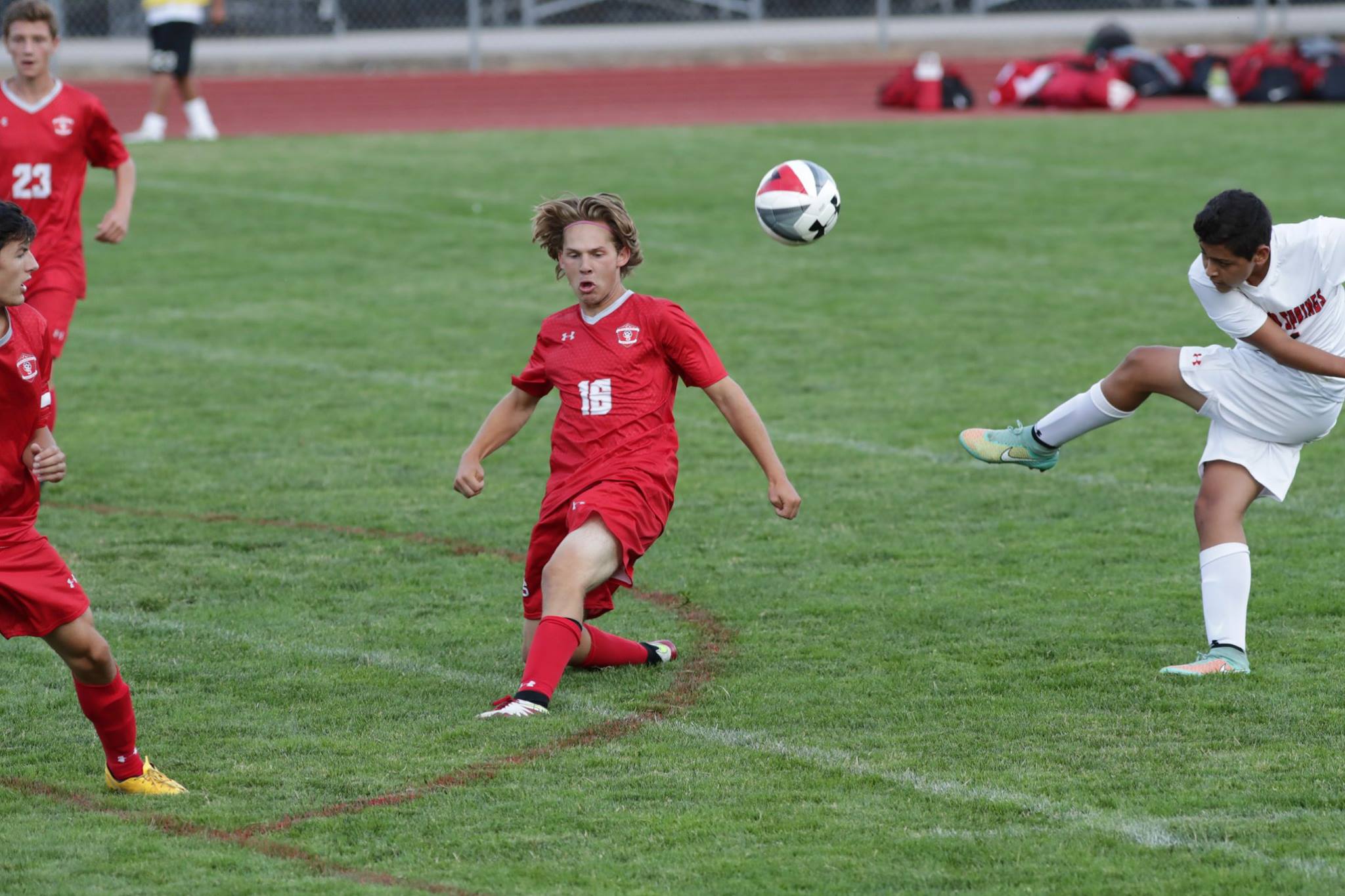 Defender Alex Coffey blocks a shot from Glenwood stricker.